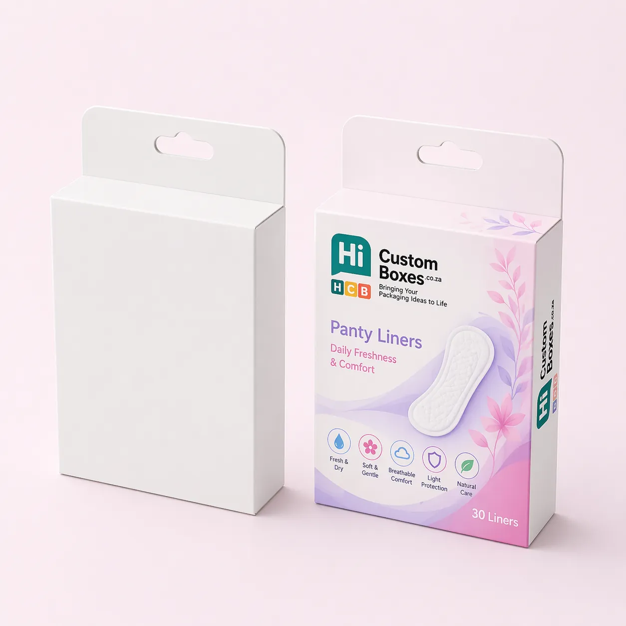 Two cardboard mailing boxes, one plain white and one featuring purple floral branding for panty liners. class=